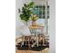 Close up view of a dining room table set for four with a modern design and natural lighting at 4100 Shaw Blvd, Westminster, CO 80031