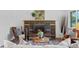 Elegant fireplace with a brick surround, flanked by stylish seating, perfect for cozy evenings at 4100 Shaw Blvd, Westminster, CO 80031
