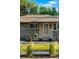 Inviting front porch featuring brick accents, blue planters, fresh landscaping, and a welcoming entrance at 4100 Shaw Blvd, Westminster, CO 80031