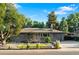 Charming brick home featuring landscaped front yard with lush trees, new roof, and convenient carport at 4100 Shaw Blvd, Westminster, CO 80031