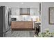 Updated kitchen featuring stainless steel appliances, sleek cabinetry, and stylish backsplash at 4100 Shaw Blvd, Westminster, CO 80031