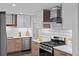 Modern kitchen features stylish cabinets, stainless steel appliances, and white subway tile backsplash at 4100 Shaw Blvd, Westminster, CO 80031