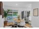 Bright dining area adjacent to the kitchen, featuring sliding glass doors and stainless steel refrigerator at 4100 Shaw Blvd, Westminster, CO 80031