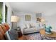 Stylish living room boasting hardwood floors, comfortable seating, and ample natural light for a welcoming atmosphere at 4100 Shaw Blvd, Westminster, CO 80031