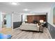 A cozy basement living room with brick fireplace, wood flooring, and neutral furniture for comfortable living at 4100 Shaw Blvd, Westminster, CO 80031