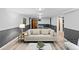 Basement living room with wainscoting, a sofa, and a game table for relaxation and entertainment at 4100 Shaw Blvd, Westminster, CO 80031