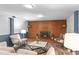 A well-lit living room showcases a brick fireplace and comfortable seating, perfect for gatherings and relaxation at 4100 Shaw Blvd, Westminster, CO 80031