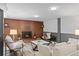 Inviting living area with brick fireplace, stylish seating, and ample natural light for a relaxing ambiance at 4100 Shaw Blvd, Westminster, CO 80031