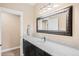 Basement bathroom with granite vanity and large mirror at 12648 Waterside Ln, Longmont, CO 80504