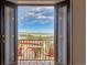 Balcony view showcasing a table and chairs, offering beautiful views of the surrounding landscape at 402 Roosevelt St, Palmer Lake, CO 80133