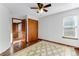 Bedroom with carpet and a closet and a small window at 402 Roosevelt St, Palmer Lake, CO 80133