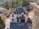 Charming two-story home with a balcony, a two-car garage, and a well-maintained gravel yard at 402 Roosevelt St, Palmer Lake, CO 80133
