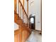 Entryway features hardwood stairs, tile floors and an attractive leaded glass door at 402 Roosevelt St, Palmer Lake, CO 80133