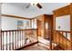 Beautiful upstairs hallway boasts decorative wood trim, adding character and charm to the home at 402 Roosevelt St, Palmer Lake, CO 80133