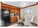 Kitchen area with dining table, oak cabinets and view to the outside at 402 Roosevelt St, Palmer Lake, CO 80133