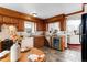 Charming kitchen with ornate wood trim, stainless steel wine cooler and a cozy eat-in area at 402 Roosevelt St, Palmer Lake, CO 80133