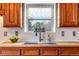 Kitchen sink with butcher block countertop and view to the outside at 402 Roosevelt St, Palmer Lake, CO 80133