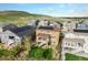 Back aerial view shows backyard deck, hot tub, and solar panels at 6173 Eldora St, Golden, CO 80403