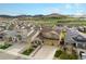 Neighborhood aerial view shows well-maintained homes with mountain backdrop at 6173 Eldora St, Golden, CO 80403