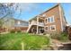 Large grassy backyard offers plenty of space for outdoor activities and entertainment at 6173 Eldora St, Golden, CO 80403