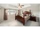 Spacious bedroom featuring a four poster bed, tray ceiling, and mountain views at 6173 Eldora St, Golden, CO 80403