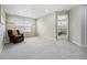 Bonus room with neutral walls, carpet floors, and a comfortable leather chair at 6173 Eldora St, Golden, CO 80403