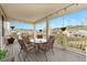 Covered deck featuring outdoor dining area with comfortable seating and neighborhood views at 6173 Eldora St, Golden, CO 80403