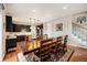 Open dining room with hardwood floors, seamlessly connecting to the kitchen at 6173 Eldora St, Golden, CO 80403