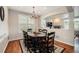 Elegant dining room with hardwood floors and natural light, adjacent to the living area at 6173 Eldora St, Golden, CO 80403