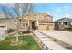 Charming two-story home boasts a three-car garage, covered porch, and well-maintained landscaping at 6173 Eldora St, Golden, CO 80403