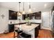 Modern kitchen with granite countertops, stainless steel appliances, and a breakfast bar at 6173 Eldora St, Golden, CO 80403
