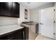 Laundry room features modern washer and dryer, folding counter and storage cabinets at 6173 Eldora St, Golden, CO 80403
