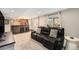 Finished basement boasts a bar, entertainment area with TV, and comfortable leather seating at 6173 Eldora St, Golden, CO 80403