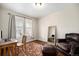 Well-lit office features hardwood floors and a comfortable sitting area at 6173 Eldora St, Golden, CO 80403