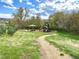 Scenic community playground offers swings, picnic area and play structure surrounded by mature trees at 6173 Eldora St, Golden, CO 80403