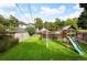 This backyard features a lush lawn, wooden fence, and a fun playset, perfect for outdoor enjoyment at 1430 Monroe St, Denver, CO 80206