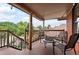 Relaxing balcony featuring outdoor seating with treed surroundings and neighborhood views at 1430 Monroe St, Denver, CO 80206