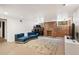 Finished basement featuring exposed brick, natural light and comfortable seating at 1430 Monroe St, Denver, CO 80206