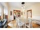 Bright dining room features hardwood floors, unique lighting, and classic design at 1430 Monroe St, Denver, CO 80206