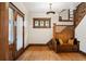 Grand foyer with hardwood floors, staircase, and leaded-glass windows, showcasing classic charm at 1430 Monroe St, Denver, CO 80206