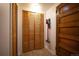 Hallway with closet and original wood trim details at 1430 Monroe St, Denver, CO 80206