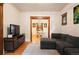 Comfortable living room with hardwood floors and an open view into the adjacent dining area at 1430 Monroe St, Denver, CO 80206