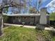 Back of house featuring chimney and patio at 1950 Glen Shiel Dr, Lakewood, CO 80215