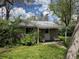 Secluded backyard featuring a patio and lawn with mature landscaping at 1950 Glen Shiel Dr, Lakewood, CO 80215