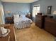 Bedroom with a bed, dresser, and vintage decor at 1950 Glen Shiel Dr, Lakewood, CO 80215
