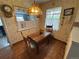 Bright and airy eating area featuring a wooden table and views into the living room at 1950 Glen Shiel Dr, Lakewood, CO 80215