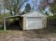 Detached garage with a lean-to carport offering covered parking or storage space at 1950 Glen Shiel Dr, Lakewood, CO 80215