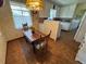 Charming kitchen nook with a wooden table, vintage wallpaper, and ample natural light at 1950 Glen Shiel Dr, Lakewood, CO 80215