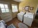 Laundry room with side-by-side washer and dryer at 1950 Glen Shiel Dr, Lakewood, CO 80215