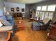 Inviting living room with a comfortable sofa, rocking chair, plush seating and natural light at 1950 Glen Shiel Dr, Lakewood, CO 80215
